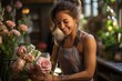 woman florist making a flower bouquet in her flower shop. happy, smiling,