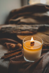 Wall Mural - Burning candle in home interior, autumn aesthetics