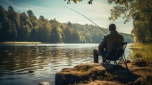 Anglers Are Enjoying A Peaceful Day, Fishing Along The Banks Of Rivers And Lakes, Surrounded By Nature