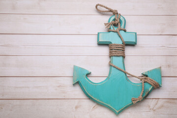 Sticker - Anchor with hemp rope on wooden table, top view. Space for text