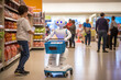 A boy in a supermarket loads items into a shopping basket attached to a humanoid robot with large cartoon-like eyes. Other customers are visible in the background, slightly blurred.