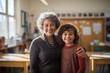© Gasi - an older teacher with her young student. classroom. education.
