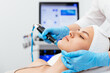 © Vladislav - Close-up shot of a young beautiful woman lying on a couch in a cosmetology center. Young woman doing hydrofacial therapy in beauty spa.