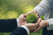 Hands of business people Embracing a Green Globe. Protecting Planet Together.Environment Earth Day. Responsibility for the environment. Ecosystem and Organization Development Cooperation.ESG and CSR.