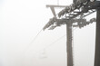 A ski lift is shrouded in thick fog in the Tatra National Park, Zakopane, Poland. Kasprowy Wierch