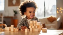 African American Toddler Playing With Wooden Block Toys