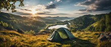 A Mesmerizing Outdoor Camping Image Capturing A Tent In The Midst Of Unspoiled Nature, Surrounded By A Magnificent And Protected Landscape.