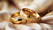 A pair of golden wedding rings.