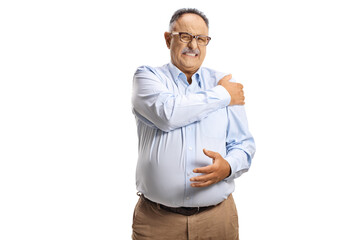 Canvas Print - Mature man in pain holding his shoulder and looking at camera