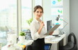 Portrait of serious strict woman in international company. Director preparing for board of management at workplace. Business concept. Blurred background