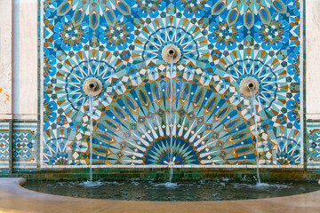 Wall Mural - The Hassan II Mosque exterior water fountain decorated with a beautiful moroccan mosaic pattern in Casablanca, Morocco.