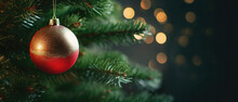 Christmas Tree With Red Bauble On Blurred Bokeh Background.