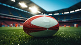 Fototapeta Sport - A rugby ball in a professional soccer stadium.
