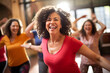 © Anzhela - Happy women enjoying a joyful dance class, candidly expressing their active lifestyle through Zumba