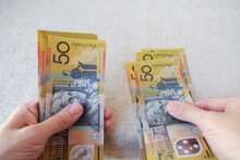 Hands Holding Fifty Dollar Notes, Australian Money