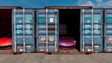 A collection of shipping containers displaying brand-new Lamborghini cars that were stolen for export but recovered by the authorities.