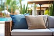© ORG - The poolside lounge has a rattan sofa with decorative pillows. Spa of wellness concept, vacation resort