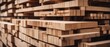 Stacked wooden bars in workshop of furniture manufacture