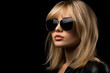 © gaukharyerk - Studio portrait of beautiful young blonde woman in sunglasses on different colour background