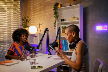 Wall Mural - African american guest is sitting in a broadcasting home studio and answering the questions