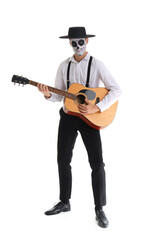 Wall Mural - Young man with painted skull playing guitar on white background. Mexico's Day of the Dead (El Dia de Muertos) celebration