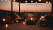 Autumn evening on beautiful house roof terrace with cozy outdoor string lights and lanterns