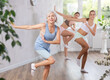 © JackF - Three generations of women are learning sports Latin American dances in studio class. Joint pastime, active hobby