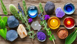 A set of healing crystals, aromatic oils, and sage.