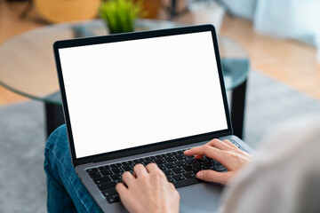 Fototapete - Woman hand type on the keyboard on laptop with mockup of blank screen for the application.