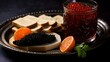 Black and red fish caviar is served with lemon slices, slices of black bread and canapes with caviar on a black background.