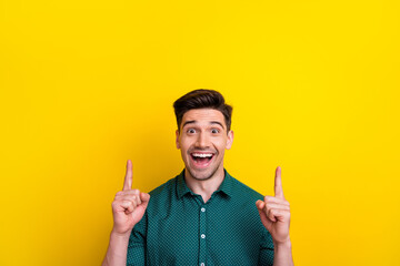 Sticker - Photo of cheerful excited man wear stylish clothes two arms presenting empty space black friday sale isolated on yellow color background