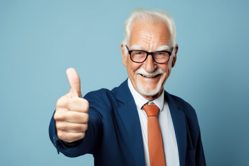 Wall Mural - Positive senior man in a business suit show big thumbs up, like gesture