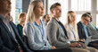 © Gorodenkoff - Young Female Psychologist Attending an International Cognitive Behavioral Therapy Seminar. Caucasian Woman Focused on Presenter. Psychotherapy Professional Sitting in Crowded Room on Training Program.
