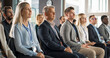 © Gorodenkoff - Male CEO Sitting in a Bright Crowded Auditorium at a Technology Conference. Confident Man Watching Interesting Keynote Presentation. Specialist Inspired by Latest Technological Advances, Developments.