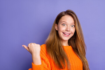 Sticker - Photo of cheerful impressed person indicate thumb finger empty space ad isolated on violet color background