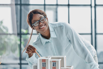 woman architect designer examines the layout of the house. new project