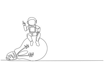 Poster - Continuous one line drawing young energetic astronaut sitting on big lightbulb raise one hand. Gestures  as having clever ideas about moon expeditions. Single line draw design vector illustration