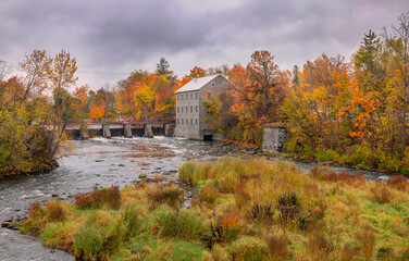 watson's mill on a cold rainy autumn morning in manotick, ontario, canada