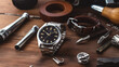 Wrist watch and tools for repair on wooden background