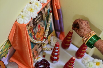 Wall Mural - Gaurihar Pooja. Bridal wedding pooja. Marathi bride worship beautiful decorations and elements. Golden Baby Krishna and Anapurna goddess. Maharashtra culture. Maharashtra wedding rituals