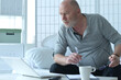 © aletia2011 - Portrait of old businessman with laptop at home