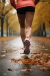 © Stavros - Jogging workout in autumn forest in rainy day. Legs of a man close up. Man during jogging workout in an autumn city park. Keeping fit in any age. Vertical photo.