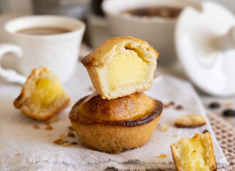 Wall Mural - Pasticciotto leccese pastry filled with egg custard cream on a napkin close up