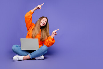 Poster - Full body photo of girl teenager sit floor point fingers interested empty space computer video games isolated on violet color background