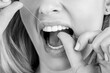 © Yevhen - Teeth Flossing. Woman use dental floss white healthy teeth. Dental flush - woman flossing teeth. Black and white