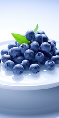 Poster - A pile of fresh blueberries arranged on a white plate. Perfect for showcasing the vibrant colors and natural beauty of blueberries. Suitable for food blogs, recipe websites, or health-related content