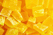Diced mango dried fruits texture background, top view. Dehydrated mango chips dices, sweet food closeup. Candied mango adds uniqueness to your snacking repertoire.