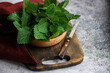 © RooM The Agency - Close-up of a bowl of fresh nettle leaves on a chopping board