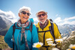 Happy smiling elderly couple with sunglasses hiking in the Alp mountains.