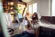 © Marko Geber - Loving father shares a tender moment with his infant amidst home renovations